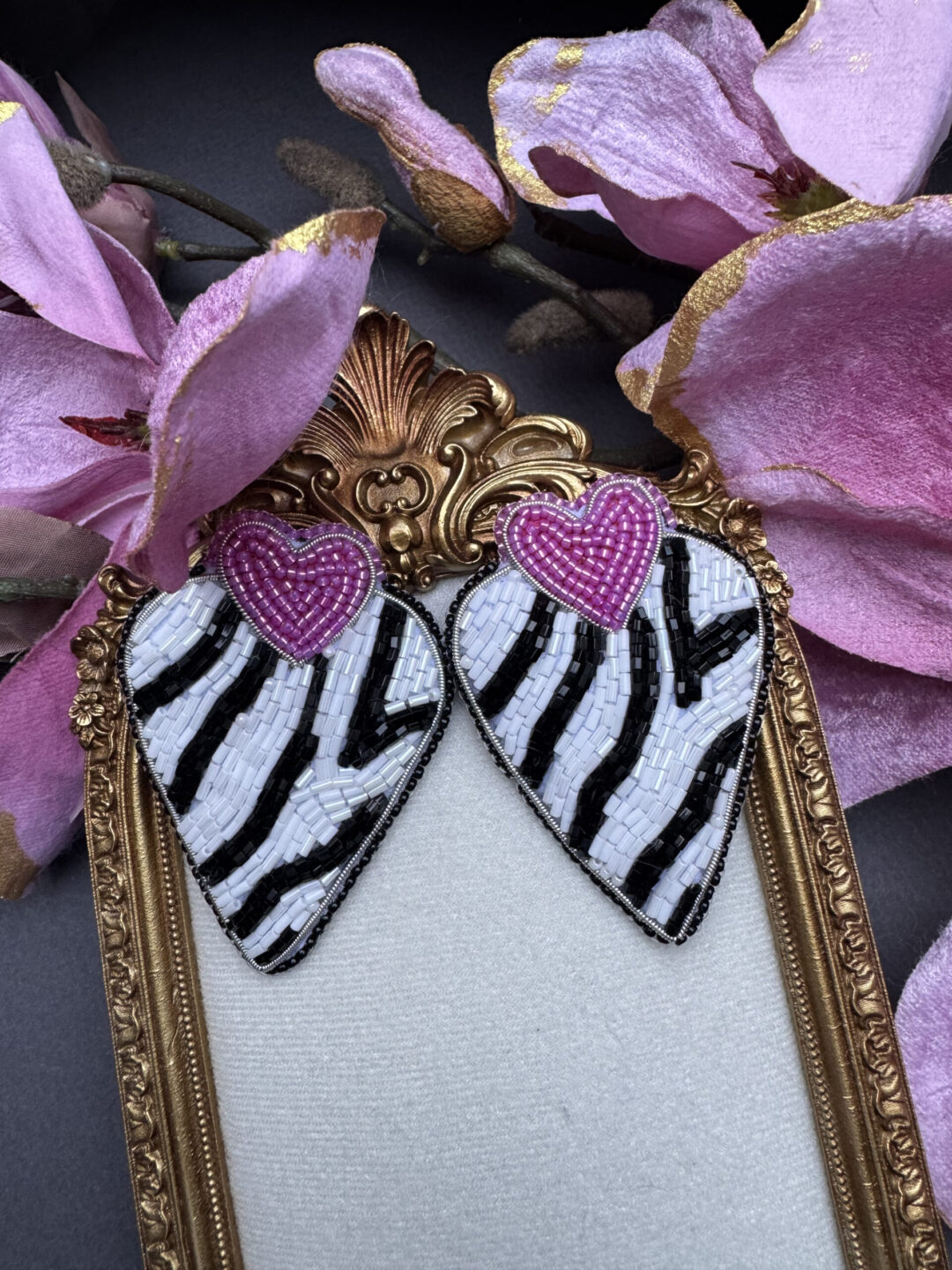 Heart-shaped earrings with a zebra pattern
